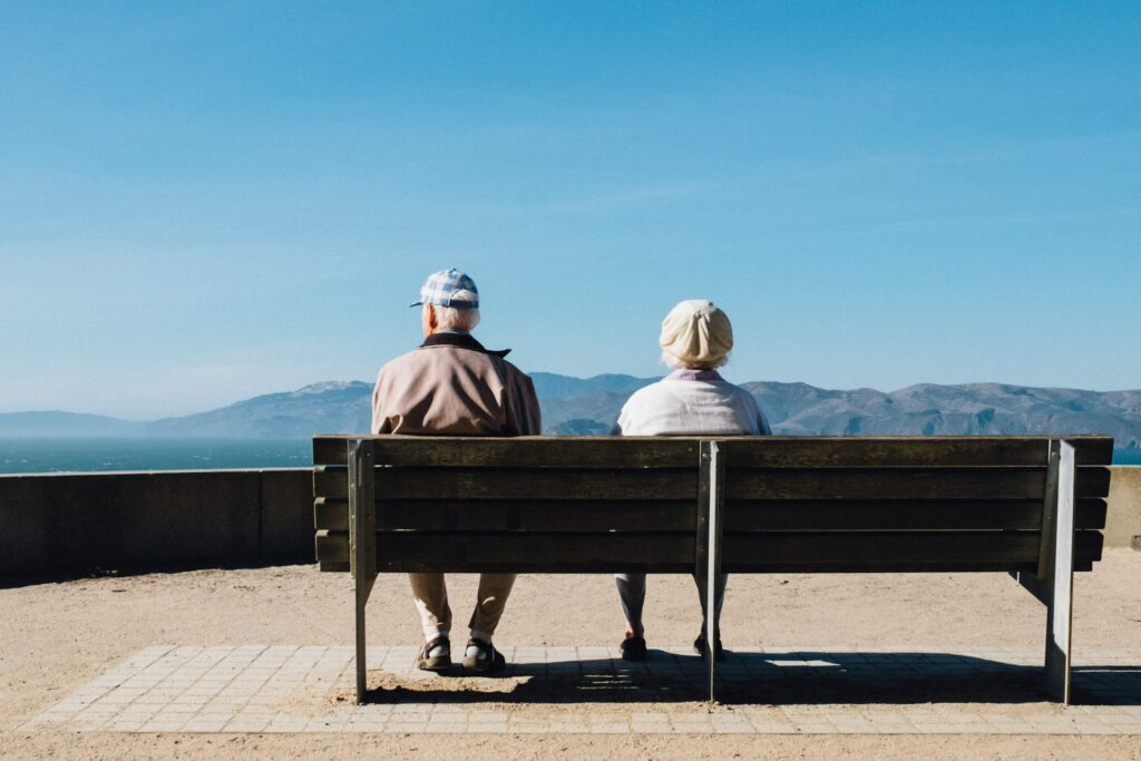 elders sitting on a park bench