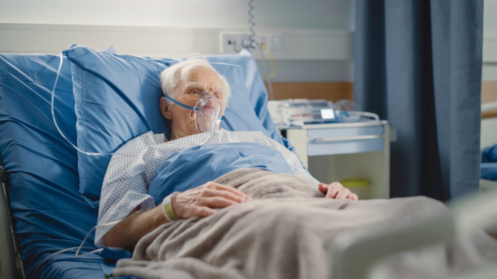 old man in hospital bed
